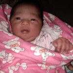 cute baby pics - A cute baby wrapped in a blanket