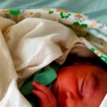 Cute Baby Pic - a child in mother's lap