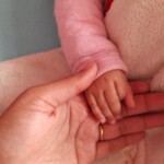 New Born Mother and Baby Holding Hands