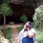 a woman taking a photograph of the nature