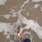 ocean water touching feet