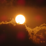 sun and black clouds