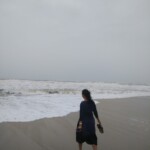 woman chasing the waves