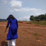 An Indian Girl walking on a slope
