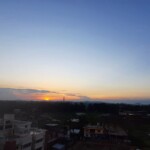 a beautiful sunset over a small town