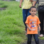 a small child walking on a track