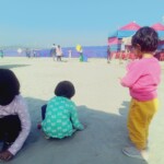 small children playing in sand